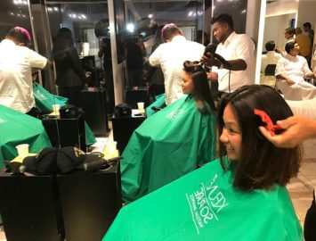 Lady at salon with male hairdresser