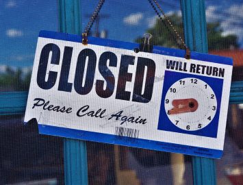 A Notice of Closed Sign on the Door salon suite location