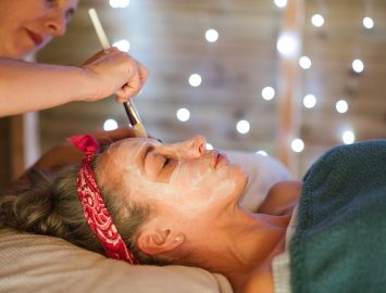 Female applying mask on face in spa Diversifying Your Salon Suite Services